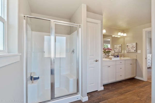 18115 E Barclay Ct Unit 2/3Stoneridge, Encore, Spokane Valley, WA 99016 - bathroom with double vanity, a stall shower, and wood finished floors
