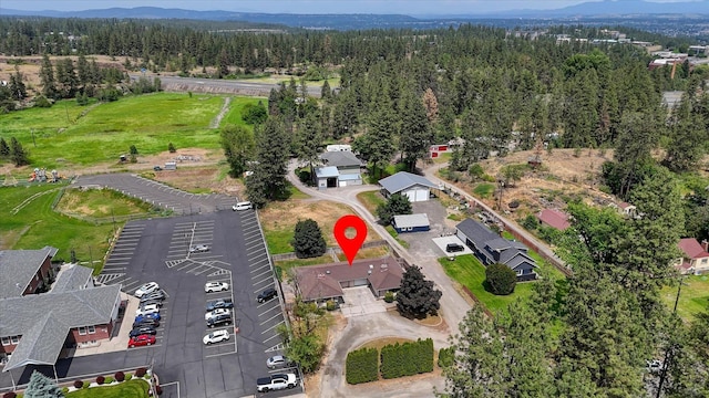 5022 W Garden Springs Ave Unit 5024W, Garden Springs, Spokane, WA 99224 - aerial overview of property's location featuring a forest and a mountainous background