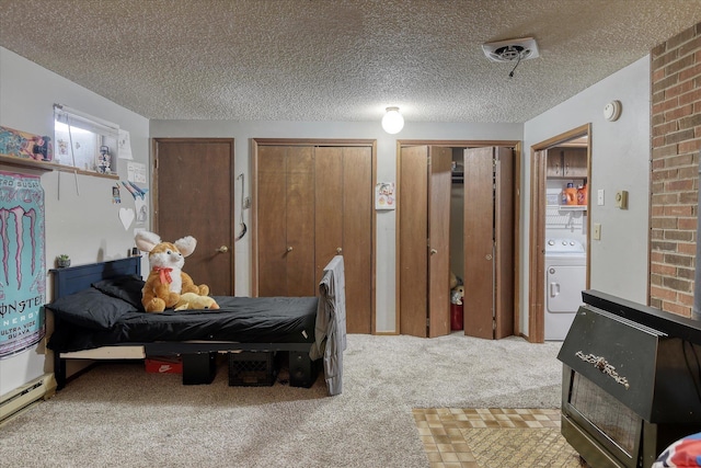 5022 W Garden Springs Ave Unit 5024W, Garden Springs, Spokane, WA 99224 - carpeted bedroom with washer / clothes dryer, multiple closets, and a textured ceiling