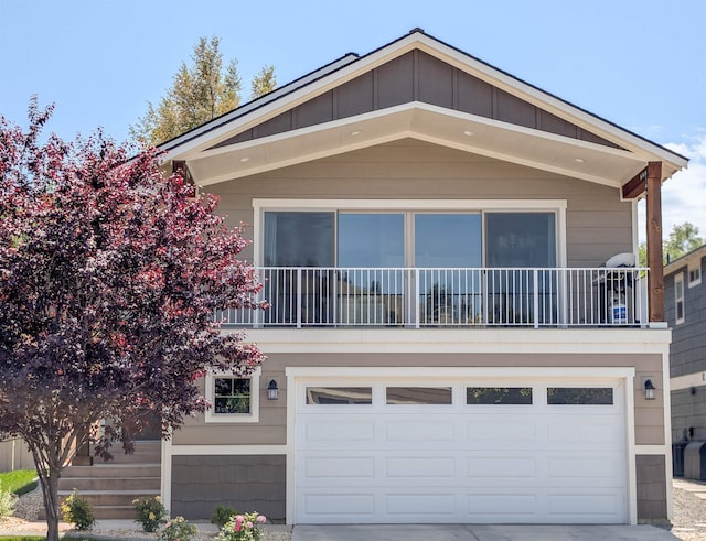 11614 E Rivercrest Dr, Spokane Valley, WA 99206 - view of front facade with an attached garage, concrete driveway, and a balcony