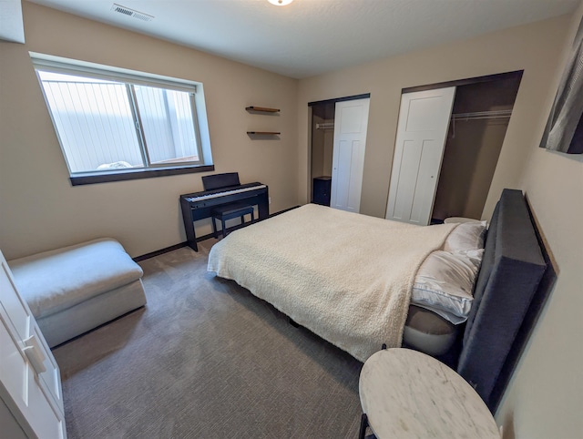 11614 E Rivercrest Dr, Spokane Valley, WA 99206 - carpeted bedroom featuring two closets and baseboards