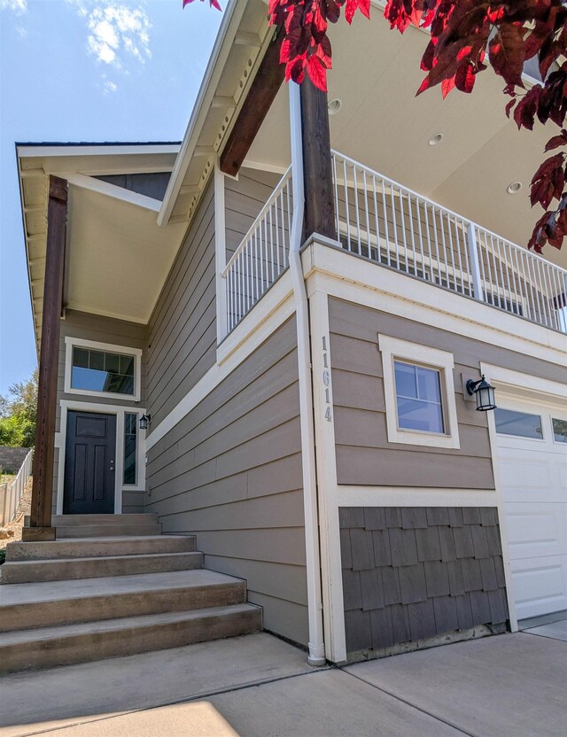 11614 E Rivercrest Dr, Spokane Valley, WA 99206 - property entrance featuring a balcony and a garage