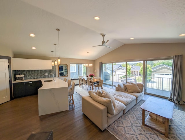 11614 E Rivercrest Dr, Spokane Valley, WA 99206 - living area with dark wood-style floors, lofted ceiling, a ceiling fan, a chandelier, and recessed lighting