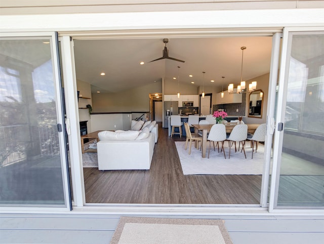 11614 E Rivercrest Dr, Spokane Valley, WA 99206 - living area with wood finished floors, lofted ceiling, and a chandelier