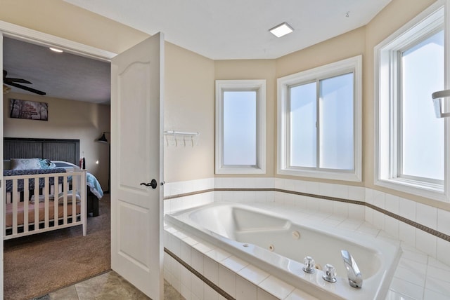 14706 N Mckinnon Ct, Mead, WA 99021 - ensuite bathroom with a whirlpool tub, tile patterned flooring, and a ceiling fan