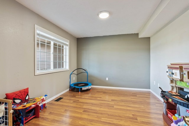 14706 N Mckinnon Ct, Mead, WA 99021 - recreation room featuring light wood-style floors and baseboards