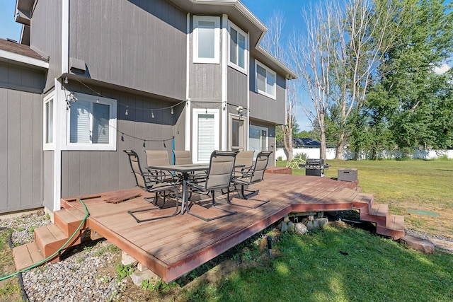 14706 N Mckinnon Ct, Mead, WA 99021 - deck featuring outdoor dining space, a lawn, and grilling area