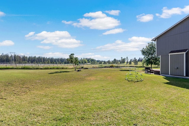 14706 N Mckinnon Ct, Mead, WA 99021 - view of green lawn with an outdoor structure and a rural view