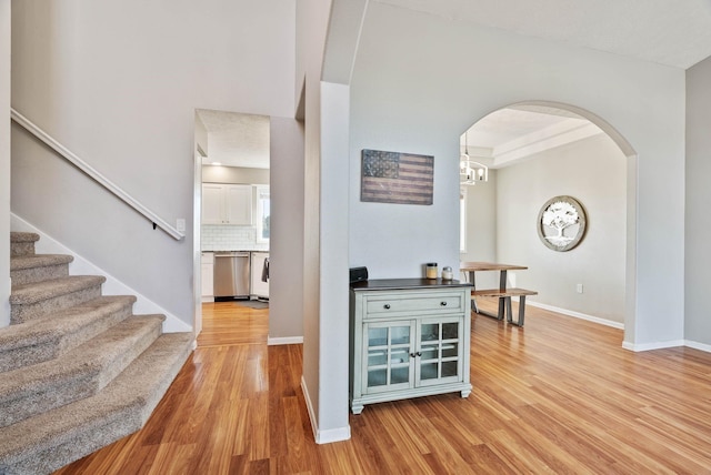 14706 N Mckinnon Ct, Mead, WA 99021 - foyer with light wood-type flooring, arched walkways, and stairway