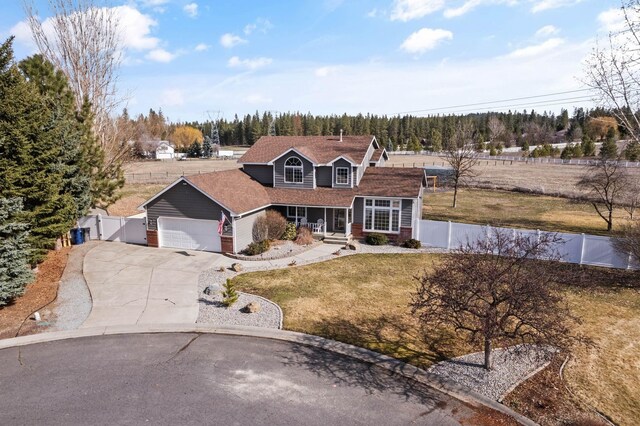 14706 N Mckinnon Ct, Mead, WA 99021 - traditional-style house with a garage, concrete driveway, covered porch, and a gate