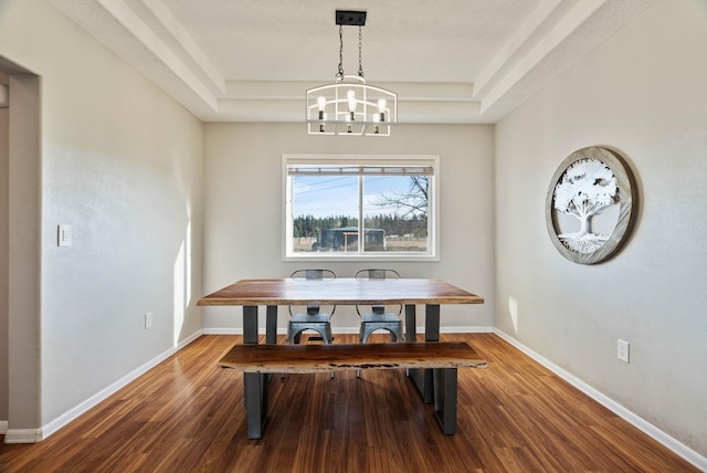 14706 N Mckinnon Ct, Mead, WA 99021 - dining room featuring a tray ceiling, a chandelier, and wood finished floors