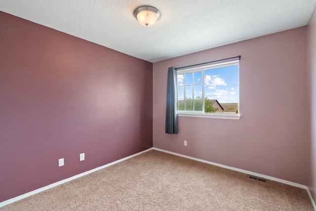 724 E Joshua Dr, Medical Lake, WA 99022 - carpeted spare room featuring baseboards and a textured ceiling