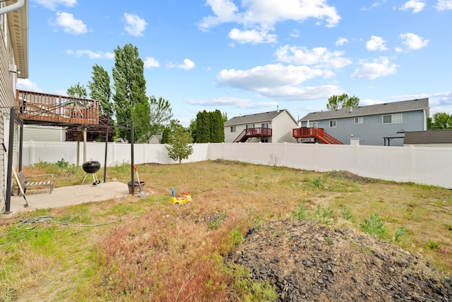 724 E Joshua Dr, Medical Lake, WA 99022 - fenced backyard with a patio and a wooden deck