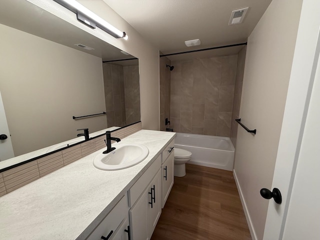 4420 S Willow Ln, Spokane, WA 99216 - full bathroom with vanity, wood finished floors, and washtub / shower combination