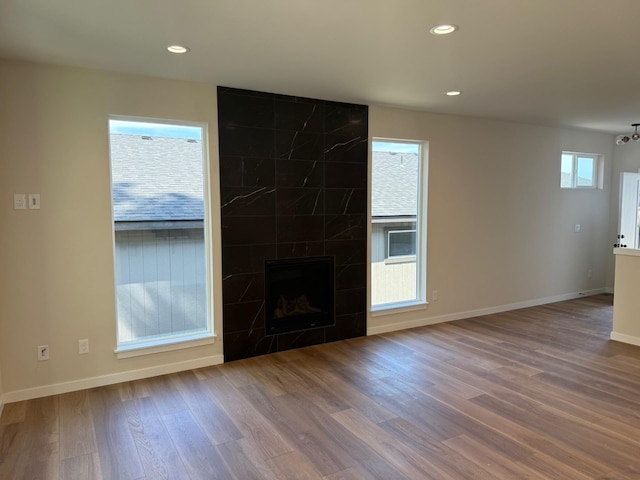 4420 S Willow Ln, Spokane, WA 99216 - unfurnished living room featuring wood finished floors, recessed lighting, and a high end fireplace