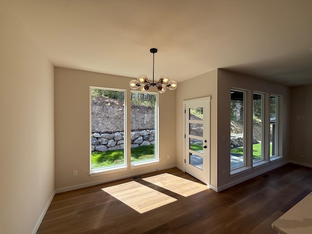4420 S Willow Ln, Spokane, WA 99216 - unfurnished dining area featuring a chandelier and dark wood-style flooring