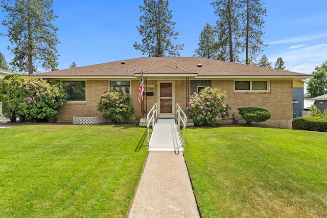 3205 W Hoffman Ave, Spokane, WA 99205 - ranch-style home with a front yard and brick siding