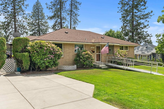 3205 W Hoffman Ave, Spokane, WA 99205 - ranch-style house featuring brick siding and a front lawn