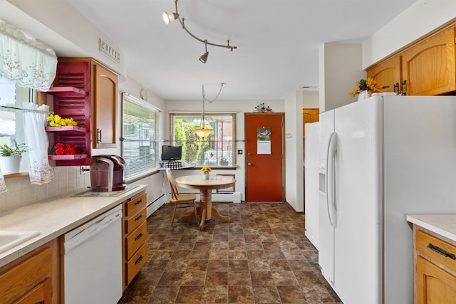 3205 W Hoffman Ave, Spokane, WA 99205 - kitchen with white appliances, light countertops, stone finish floors, pendant lighting, and tasteful backsplash