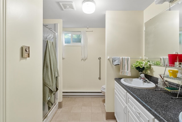 3205 W Hoffman Ave, Spokane, WA 99205 - bathroom featuring baseboard heating, a shower stall, vanity, and tile patterned flooring