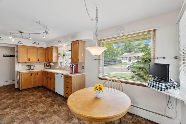 3205 W Hoffman Ave, Spokane, WA 99205 - kitchen featuring dishwasher, baseboard heating, light countertops, and healthy amount of natural light