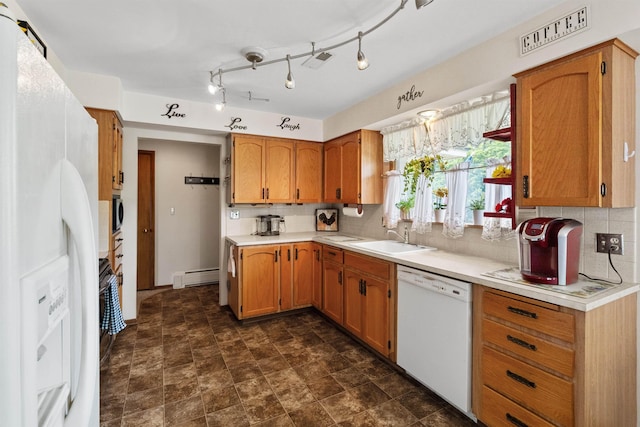 3205 W Hoffman Ave, Spokane, WA 99205 - kitchen featuring white appliances, a baseboard radiator, light countertops, tasteful backsplash, and brown cabinetry