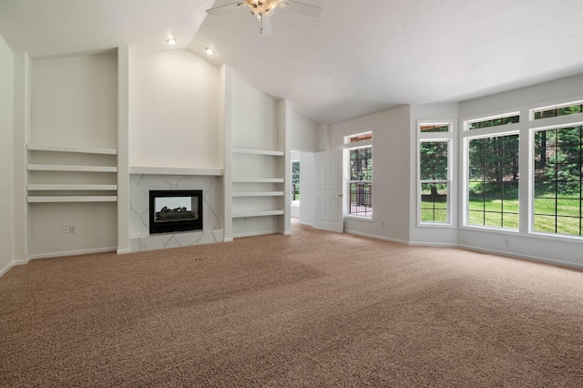 16417 N Napa Ln, Spokane, WA 99208 - unfurnished living room featuring carpet flooring, a ceiling fan, a fireplace, built in features, and high vaulted ceiling