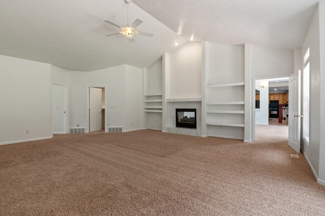 16417 N Napa Ln, Spokane, WA 99208 - unfurnished living room with carpet, ceiling fan, a fireplace, high vaulted ceiling, and built in shelves