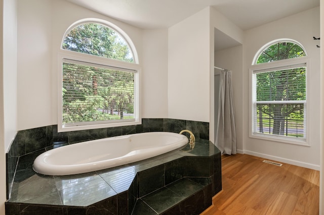 16417 N Napa Ln, Spokane, WA 99208 - bathroom with a garden tub and wood finished floors