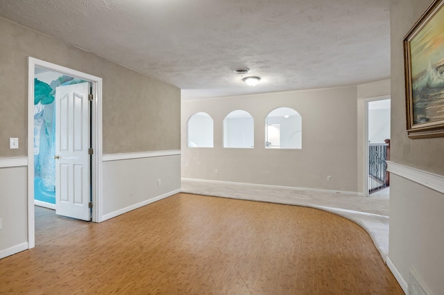 16417 N Napa Ln, Spokane, WA 99208 - unfurnished room featuring wood finished floors and a textured ceiling
