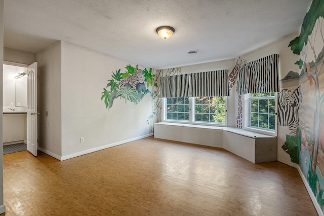 16417 N Napa Ln, Spokane, WA 99208 - unfurnished room featuring wood finished floors and a textured ceiling