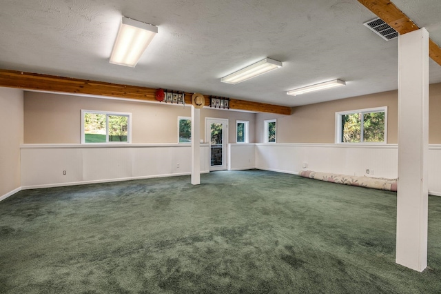 16417 N Napa Ln, Spokane, WA 99208 - empty room with healthy amount of natural light, carpet floors, and a textured ceiling