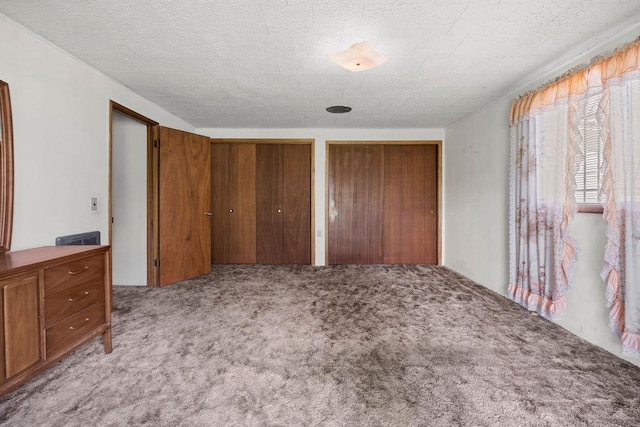 2920 N Regal St, Spokane, WA 99207 - unfurnished bedroom with two closets and carpet