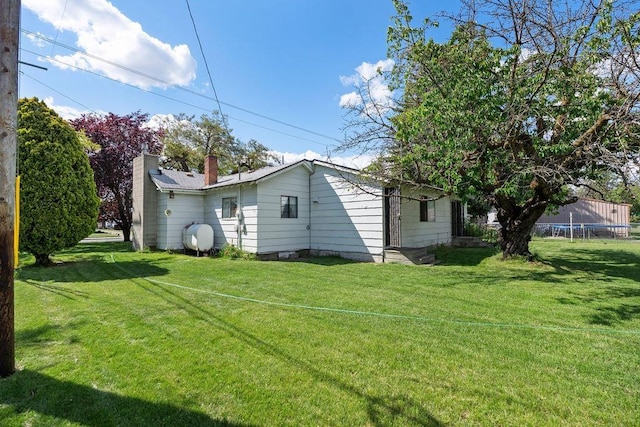 2920 N Regal St, Spokane, WA 99207 - view of grassy yard featuring a trampoline