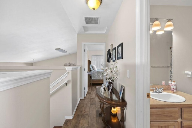 8910 N Oak St, Spokane, WA 99208 - corridor featuring a sink and dark wood-type flooring