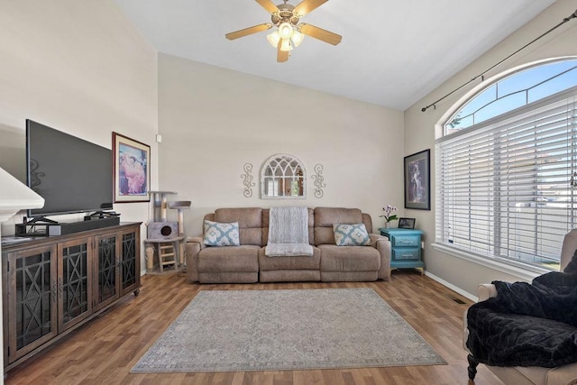 8910 N Oak St, Spokane, WA 99208 - living room featuring a ceiling fan, wood finished floors, and high vaulted ceiling