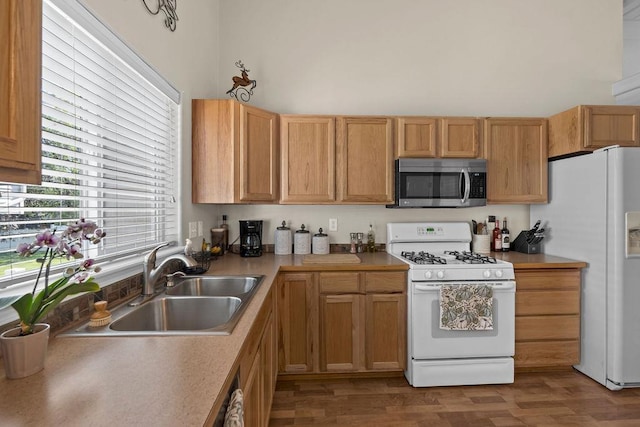 8910 N Oak St, Spokane, WA 99208 - kitchen featuring white appliances, wood finished floors, and light countertops