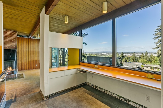 3717 E 17th Ave, Spokane, WA 99223 - surrounding community featuring a lit fireplace and wood ceiling