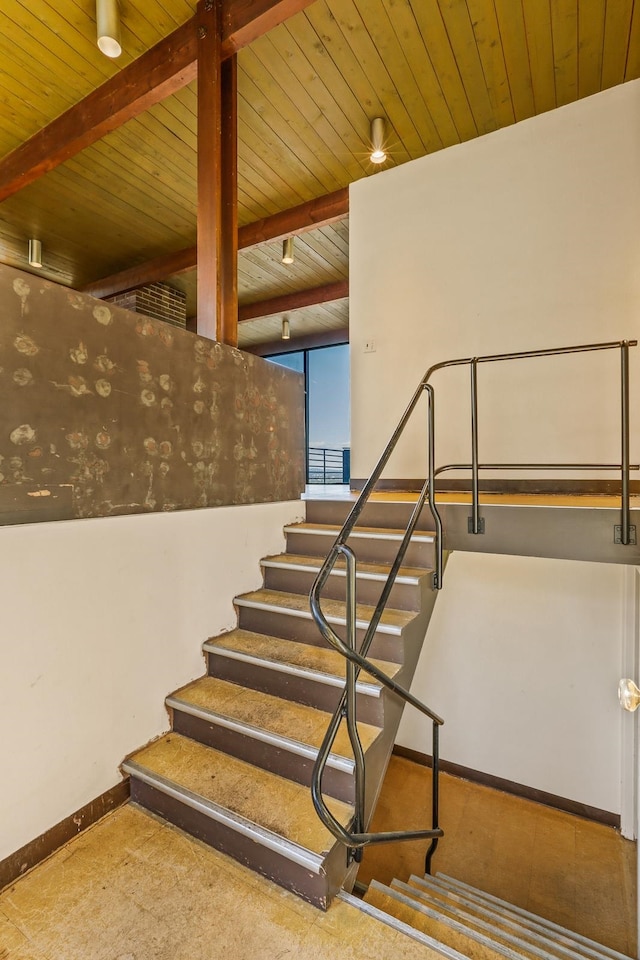 3717 E 17th Ave, Spokane, WA 99223 - staircase with a wood ceiling with exposed beams and baseboards