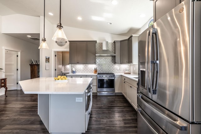 22830 E Bailey Ct, Liberty Lake, WA 99019 - kitchen with stainless steel appliances, wall chimney exhaust hood, lofted ceiling, a center island, and dark wood finished floors