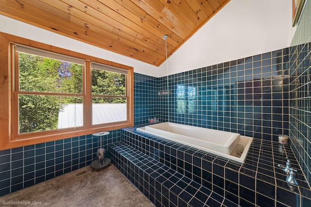 32261 N Leclerc Rd, Ione, WA 99139 - bathroom featuring vaulted ceiling, a garden tub, wood ceiling, and tile walls