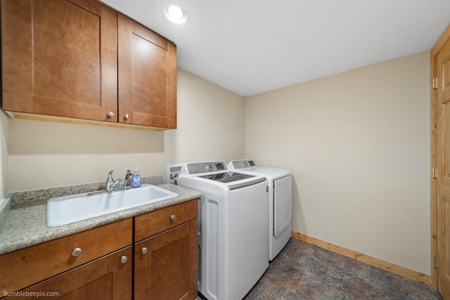 32261 N Leclerc Rd, Ione, WA 99139 - laundry area featuring cabinet space, washing machine and clothes dryer, and dark stone finish floors