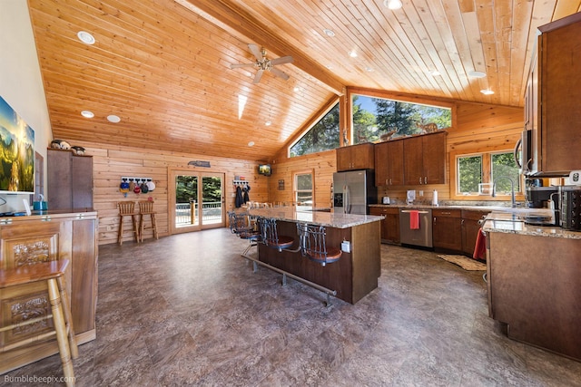 32261 N Leclerc Rd, Ione, WA 99139 - kitchen with stainless steel appliances, wooden ceiling, high vaulted ceiling, wood walls, and a center island