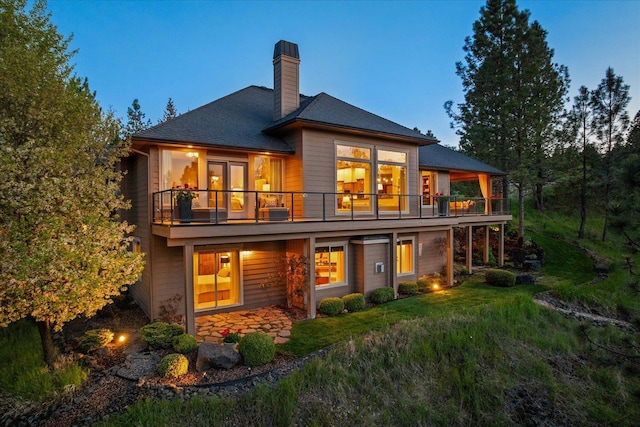2415 E Hangman Creek Ln, Spokane, WA 99224 - rear view of house with a chimney and a balcony