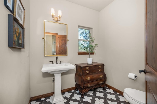 2415 E Hangman Creek Ln, Spokane, WA 99224 - half bathroom featuring baseboards and tile patterned floors