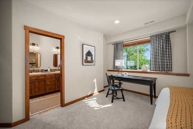 2415 E Hangman Creek Ln, Spokane, WA 99224 - carpeted bedroom featuring baseboards and connected bathroom