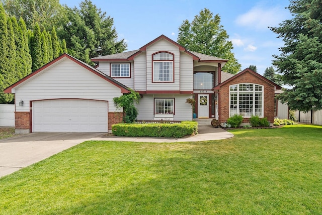 15718 E 21st Ct, Spokane Valley, WA 99037 - view of front of home featuring concrete driveway, a garage, a front lawn, and brick siding