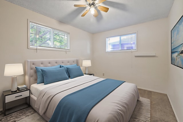 621 E Dalke Ave, Spokane, WA 99208 - carpeted bedroom with multiple windows and a ceiling fan