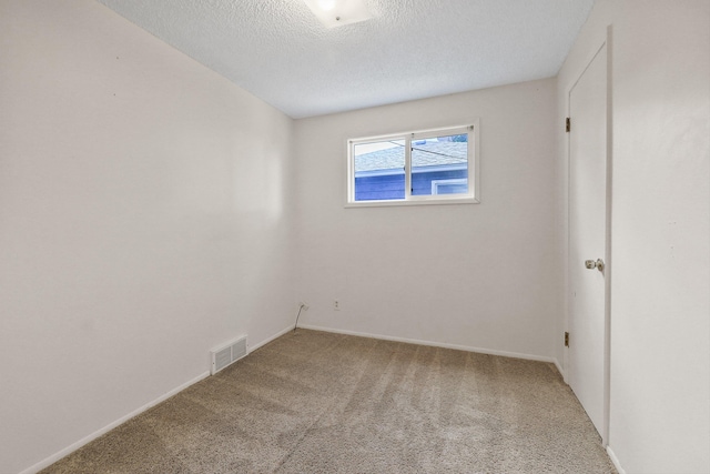 621 E Dalke Ave, Spokane, WA 99208 - carpeted spare room with a textured ceiling and baseboards