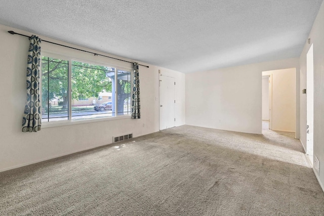 621 E Dalke Ave, Spokane, WA 99208 - carpeted spare room with a textured ceiling